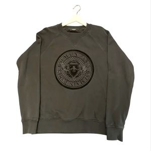 Balmain men’s sweatshirt.  Black cotton, with black emblem. Size XL.